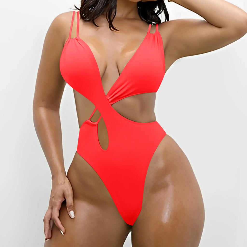 Women's solid colour one-piece triangle swimsuit with backless design in nylon.