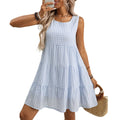 Women's sleeveless plaid dress with an oversized swing skirt in light blue, shown on a mannequin.