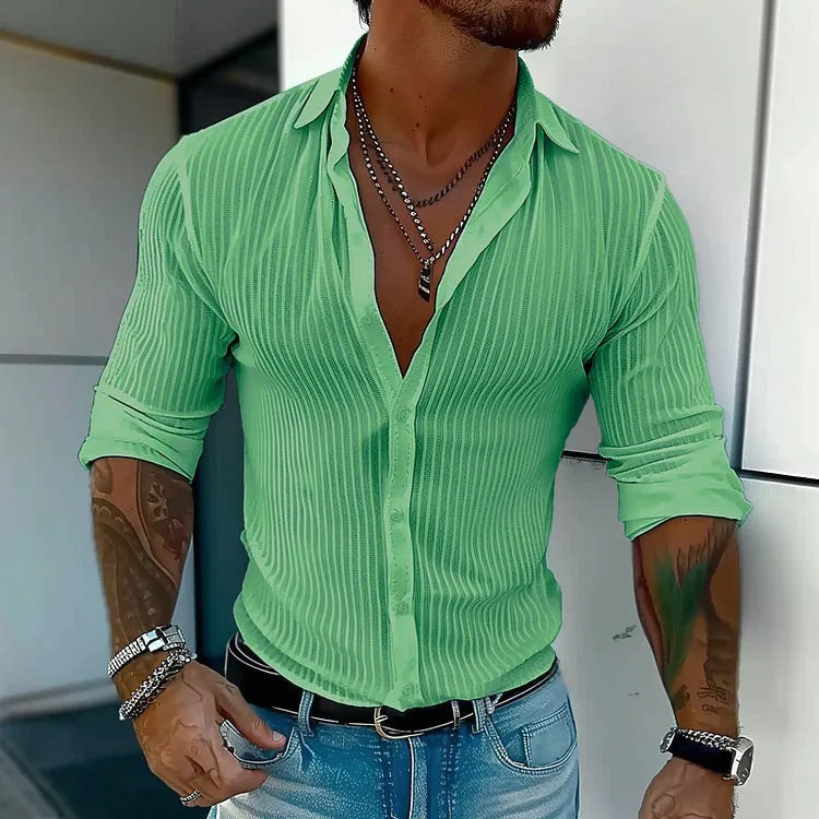 Man wearing a striped British style loose fit long sleeve cardigan shirt.