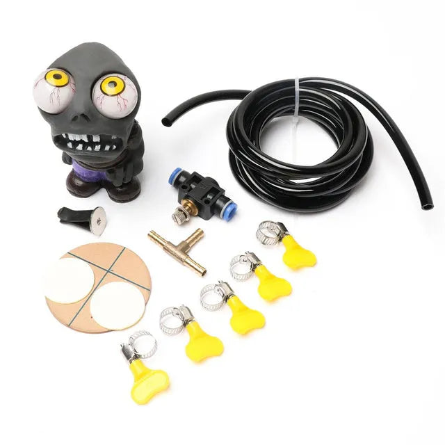 Turbo car blow-off valve sound kit with rubber doll ornament, pressure valve, copper tube, and mounting clips.