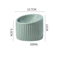Ceramic elevated cat bowl in green, tilted design for anti-vomit, whisker-friendly feeding.