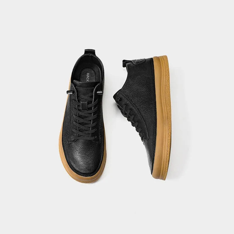 Men's black casual leather shoes with round toe and lace-up closure on white background