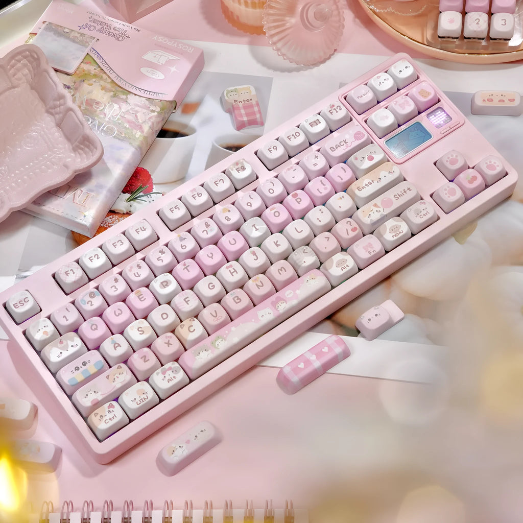 MOA height pink sublimation keyboard keycap set with cartoon design, shown on a keyboard.