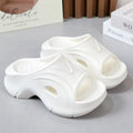 Women's thick-soled EVA beach slippers in black, white and rose red colours