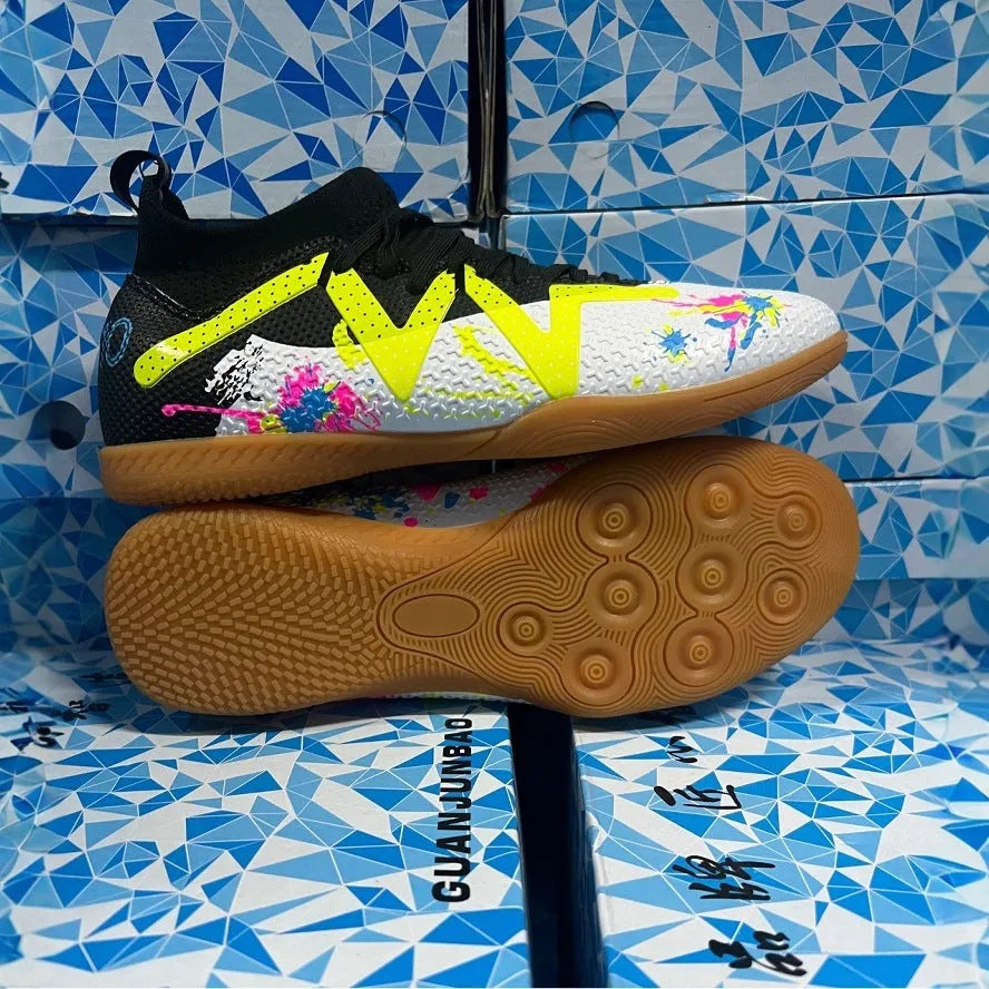 Adult low-top football boots in Black and Yellow colour with mesh lining and rubber sole.