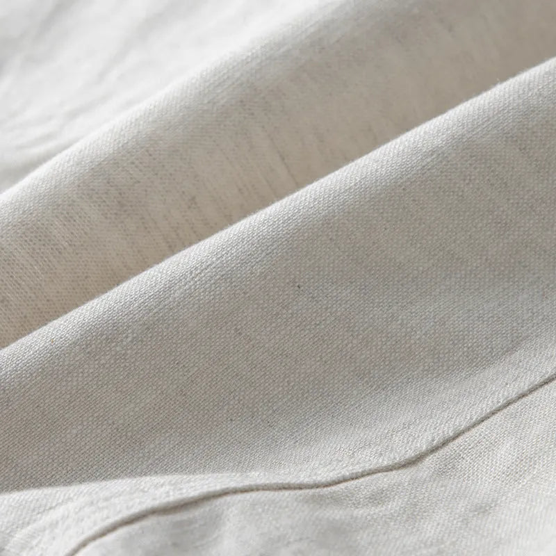 Men's loose-fit linen casual suit jacket in a solid colour, shown with long sleeves.