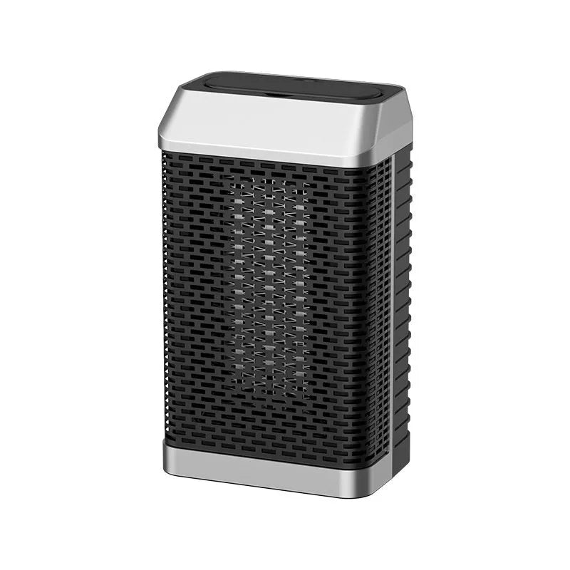 Black remote-controlled desktop heater with oscillating head on a wooden surface.