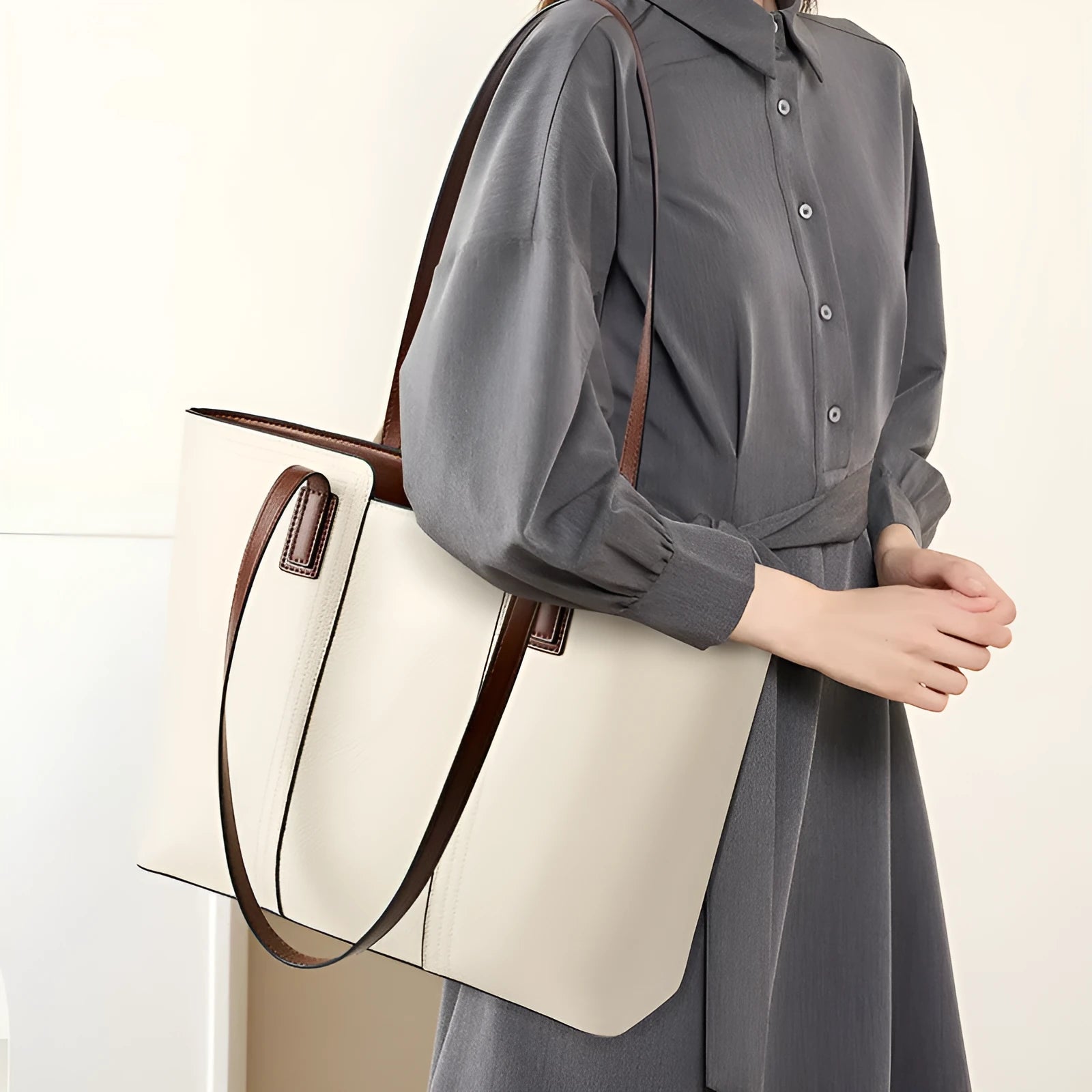 Women's black genuine leather crossbody commuter bag with square shape and multiple internal pockets.