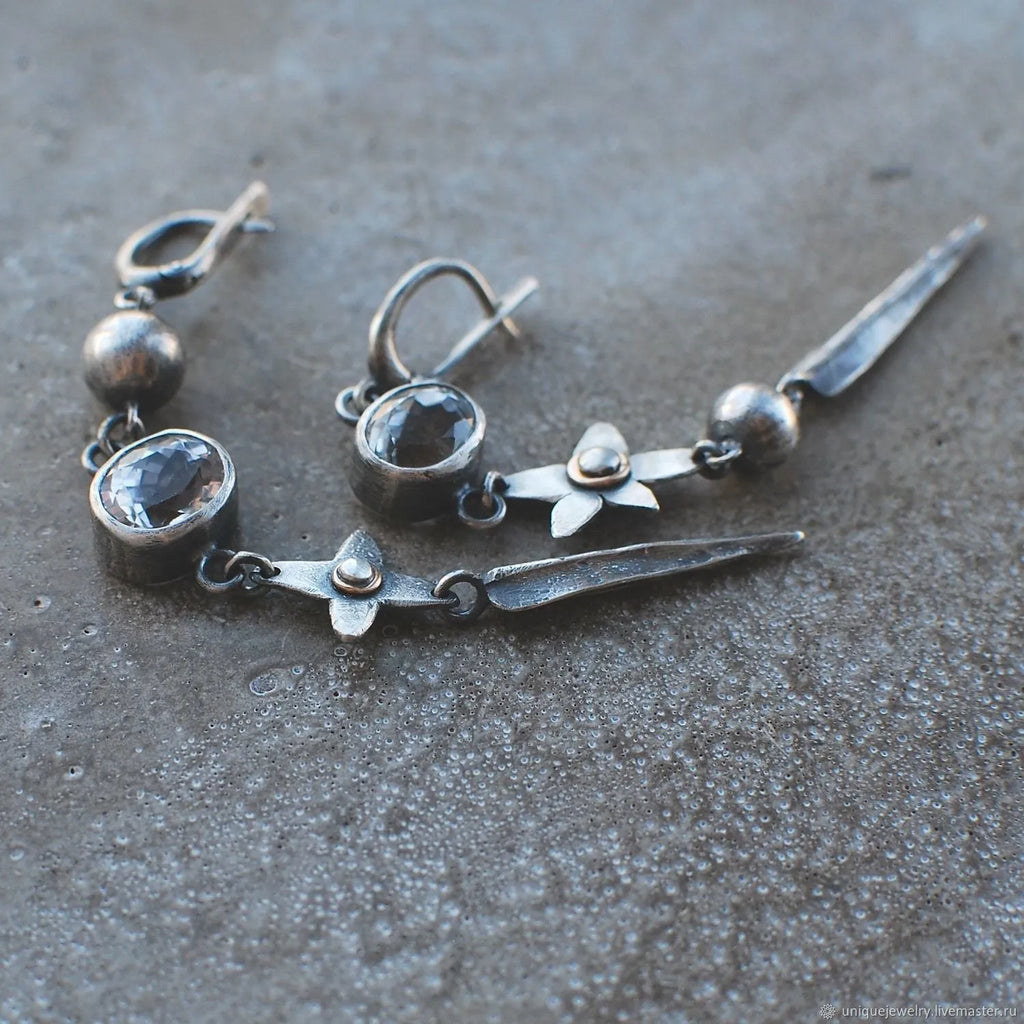 Geometric antique silver pendant earrings with XINGX rhinestone design
