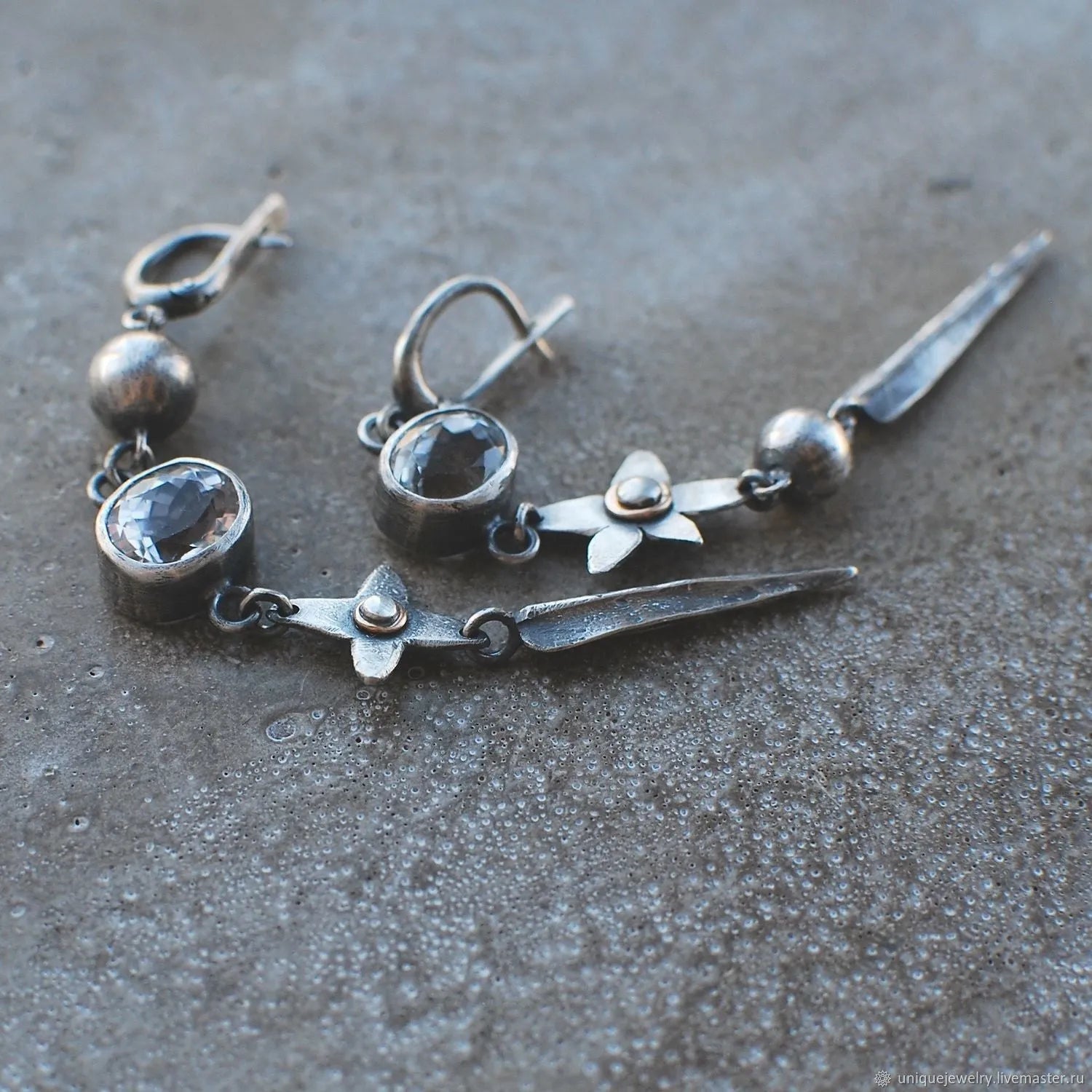 Geometric antique silver pendant earrings with XINGX rhinestone design
