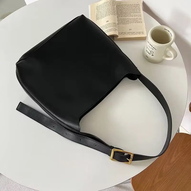 Women's soft PU leather shoulder bag with swing threads in black ribbon and brown with packet styles