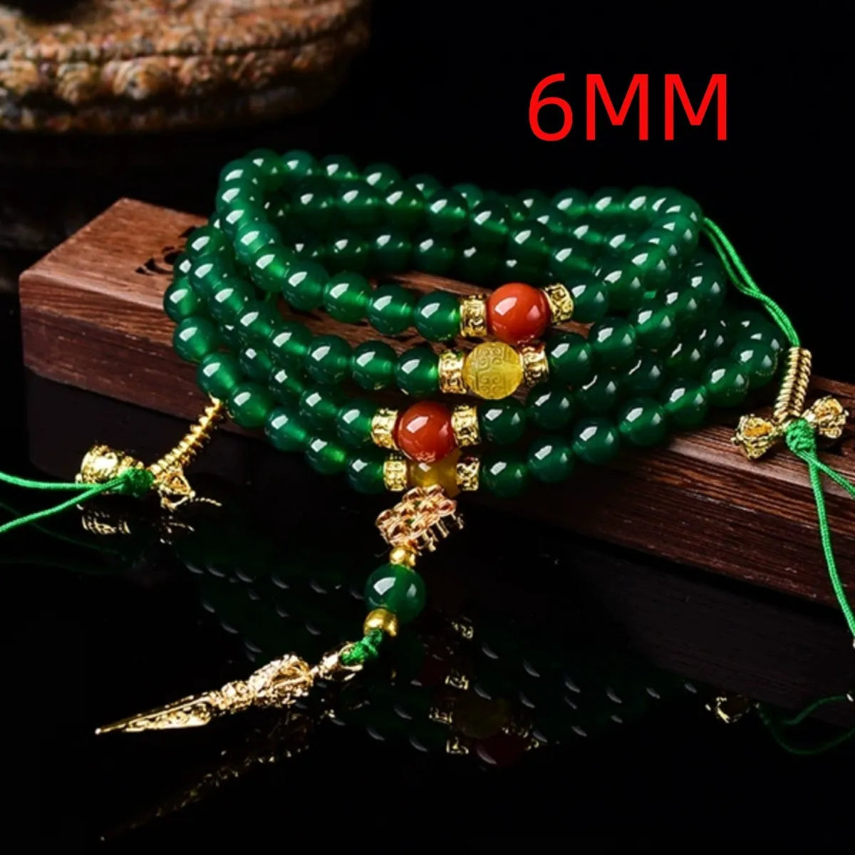 Close-up of a multi-circle green agate bracelet for men and women on a wrist.