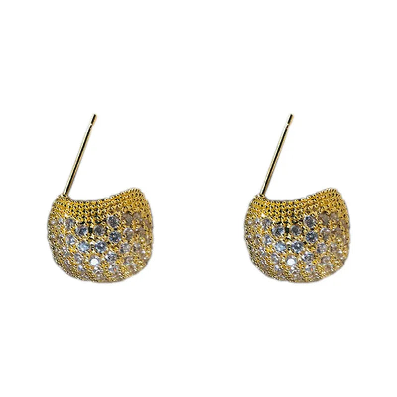Gold or white geometric drop-shaped clip earrings with spherical bead elements