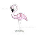 Pink crystal flamingo decorative ornament on table with modern minimalist style