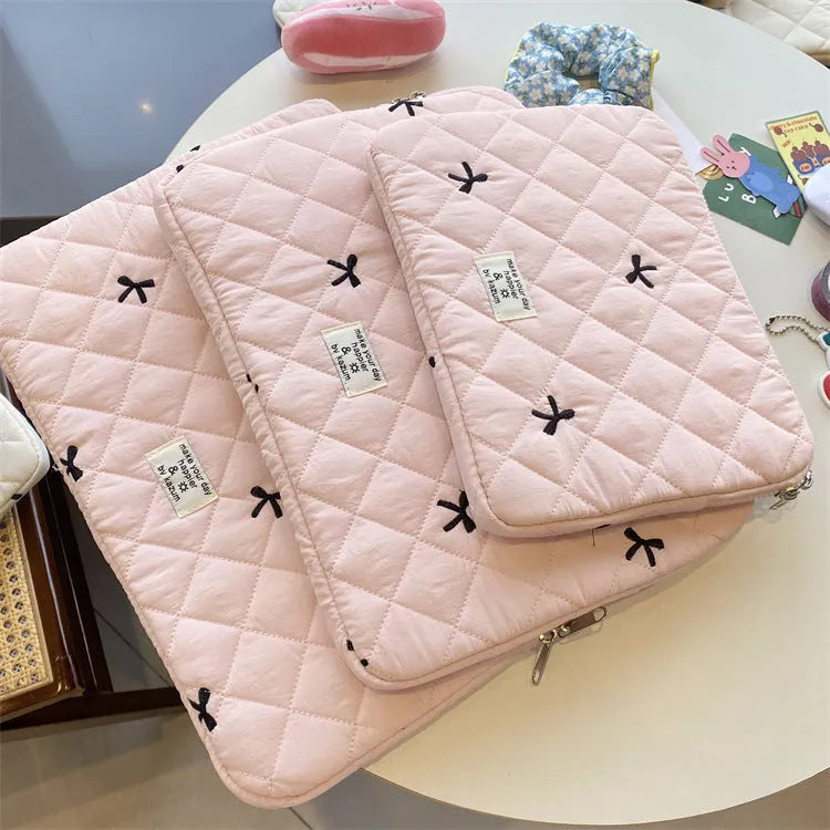 White laptop storage bag with rhombus embroidery and bow design in nylon fabric
