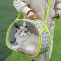 Transparent hard-shell space capsule backpack for a cat, shown in a choice of colours including grass green and pink.