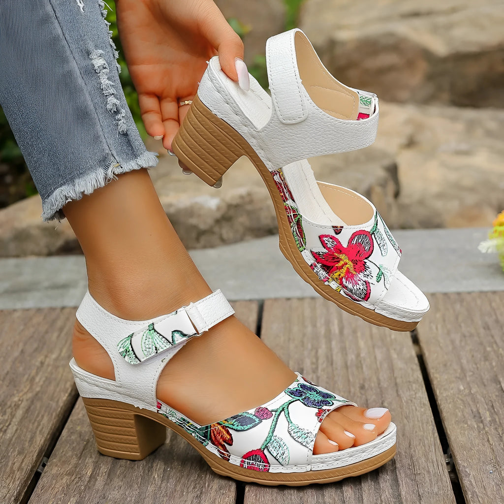 White women's high heel sandals with adjustable Velcro buckle strap on a casual rubber sole.