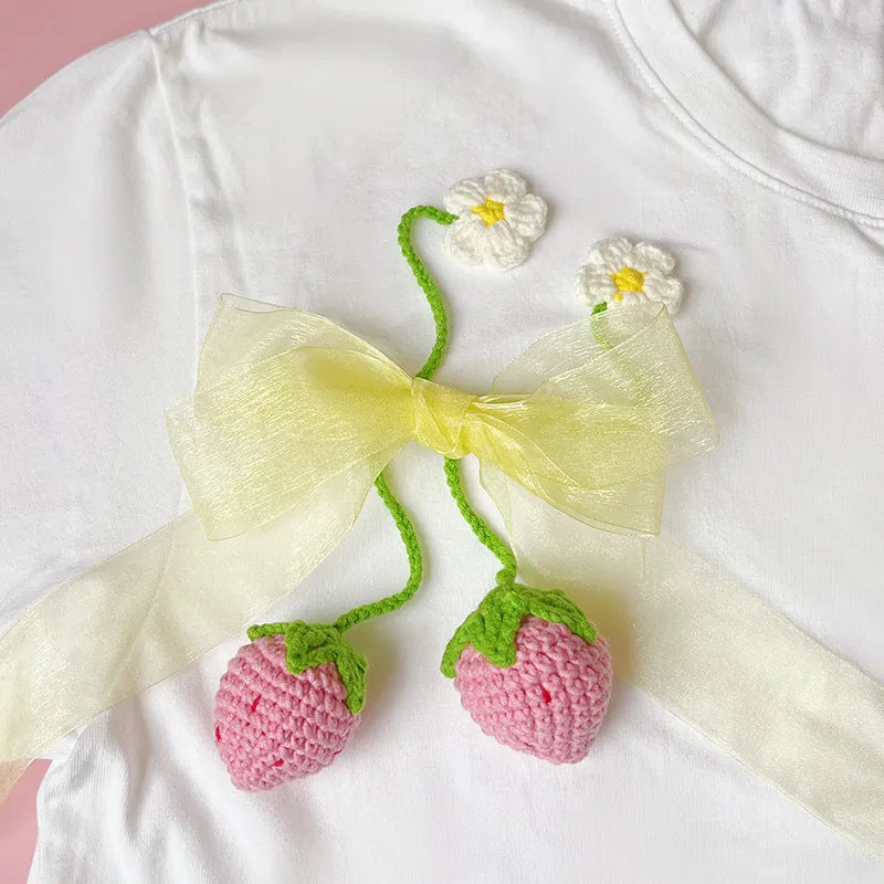 Knitted wool strawberry pendant necklace with 35cm cord and woven charm