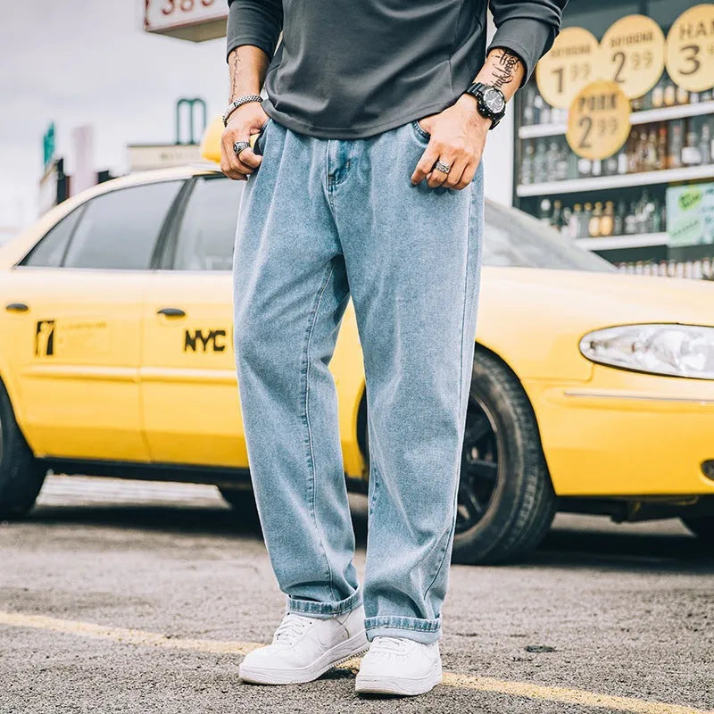 Men's loose straight simple jeans in dark blue cotton with mid waist and zipper fly available in plus sizes