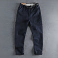 Men's cotton work trousers with NI buckle belt in khaki colour showing three-dimensional cutting detail