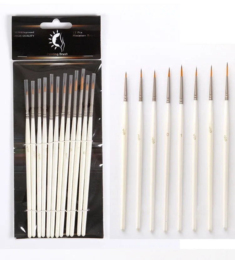 12 pearl white handled artist brushes with nylon wool bristles, stored upright in a solid wood pen holder.