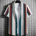 Man wearing a striped linen short sleeve t-shirt with a 3D printed graphic design.