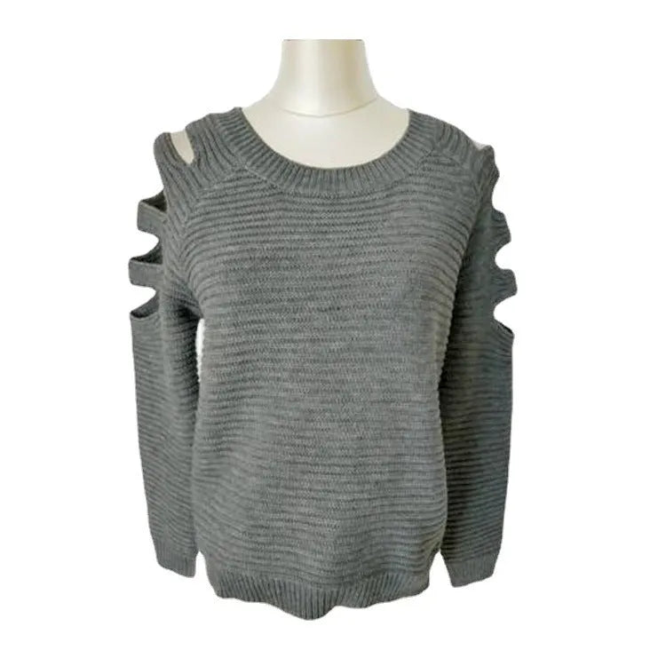 Women's white hollow-out crocheted knit long sleeve pullover shirt on a hanger.