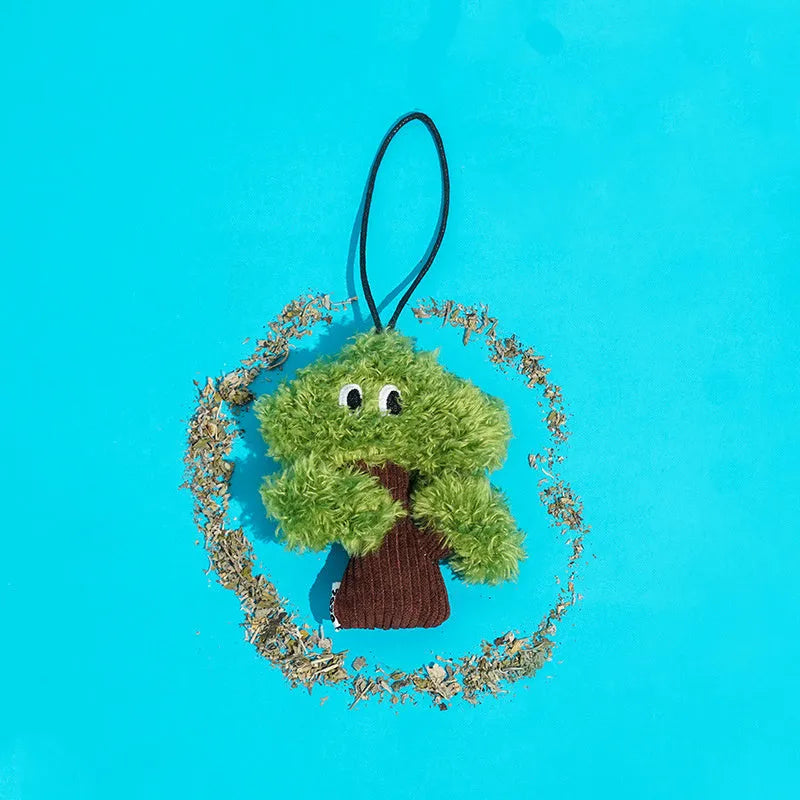 Green pine tree-shaped cat chew toy with a hanging loop, shown with size options.