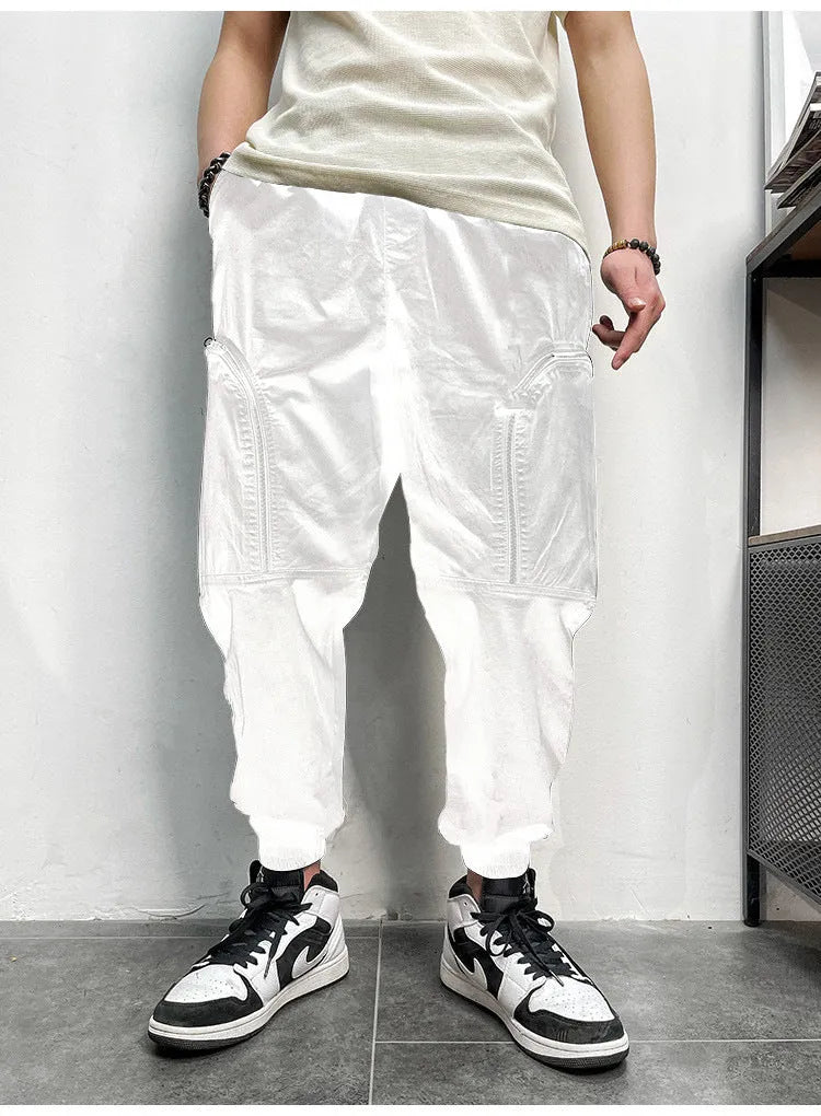 Men's elastic waist cotton cargo trousers with zippered pockets, loose fit, in khaki colour on plain background