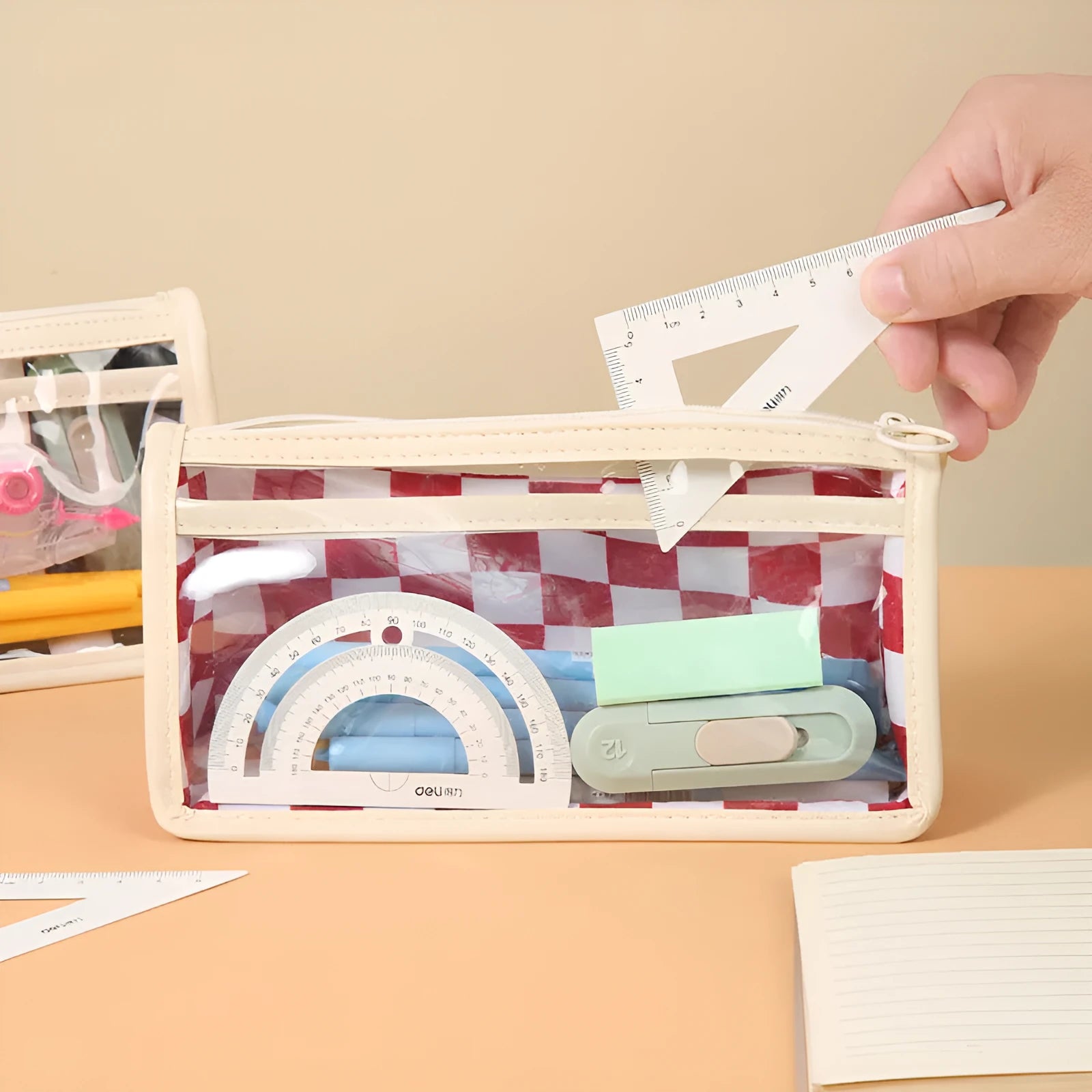 Transparent PVC pencil case with chessboard pattern measuring 21.5 cm long