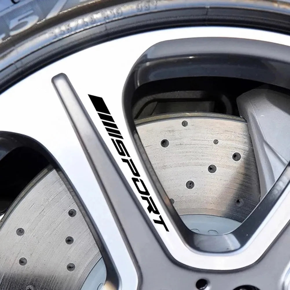 Black hollow design sports car rim sticker measuring 10cm by 0.7cm on an alloy wheel.