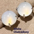 Round egg surface chalcedony stud earrings with four-claw copper settings in green, white, or pink.