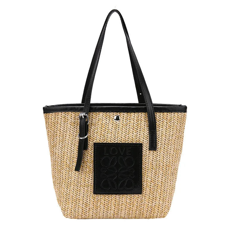 Straw woven women's shoulder bag with retro design showing three-dimensional pockets and 18cm handle