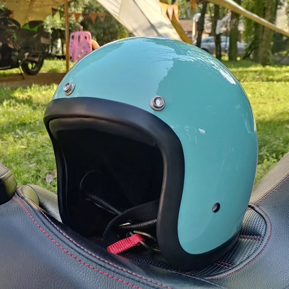 A cement grey retro-style half motorcycle helmet made from FRP glass fibre, shown on a white background.