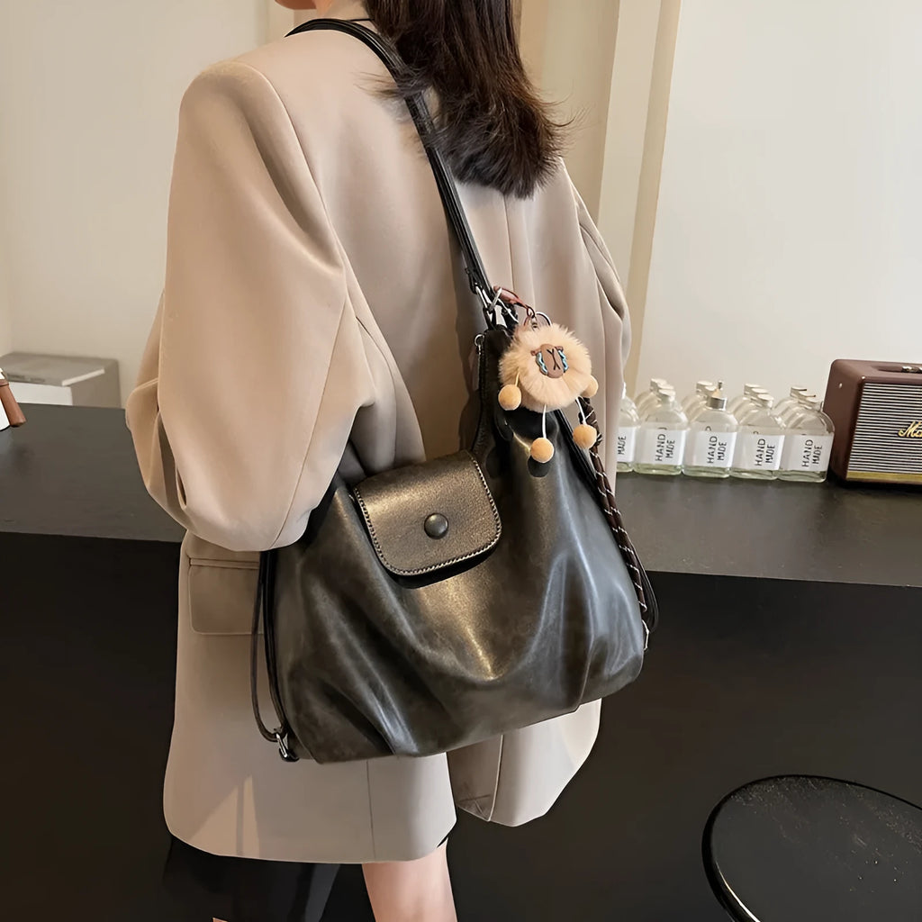 Textured PU leather shoulder bag in horizontal square shape with single strap and internal phone pocket