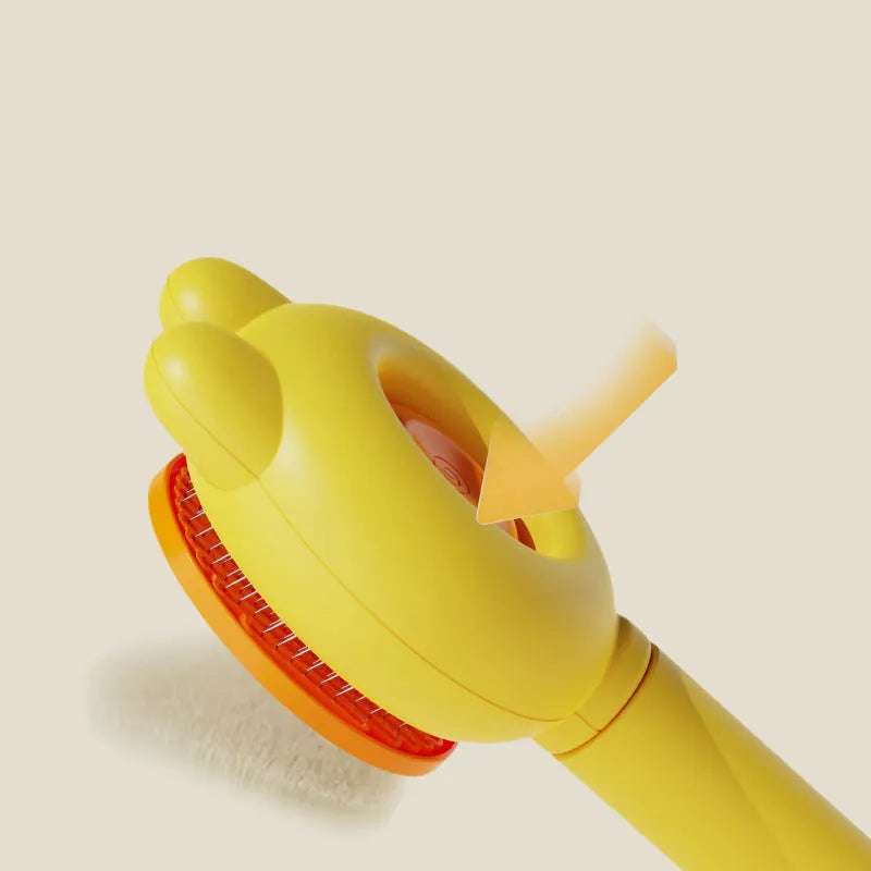 Self-cleaning pet grooming brush with coloured handle and stainless steel comb teeth