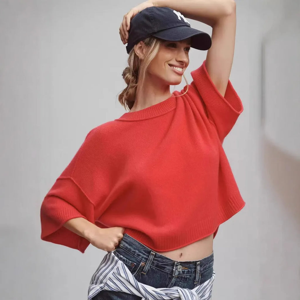 Red cropped viscose T-shirt with an exposed navel design on a mannequin, showing the short length and regular sleeves.