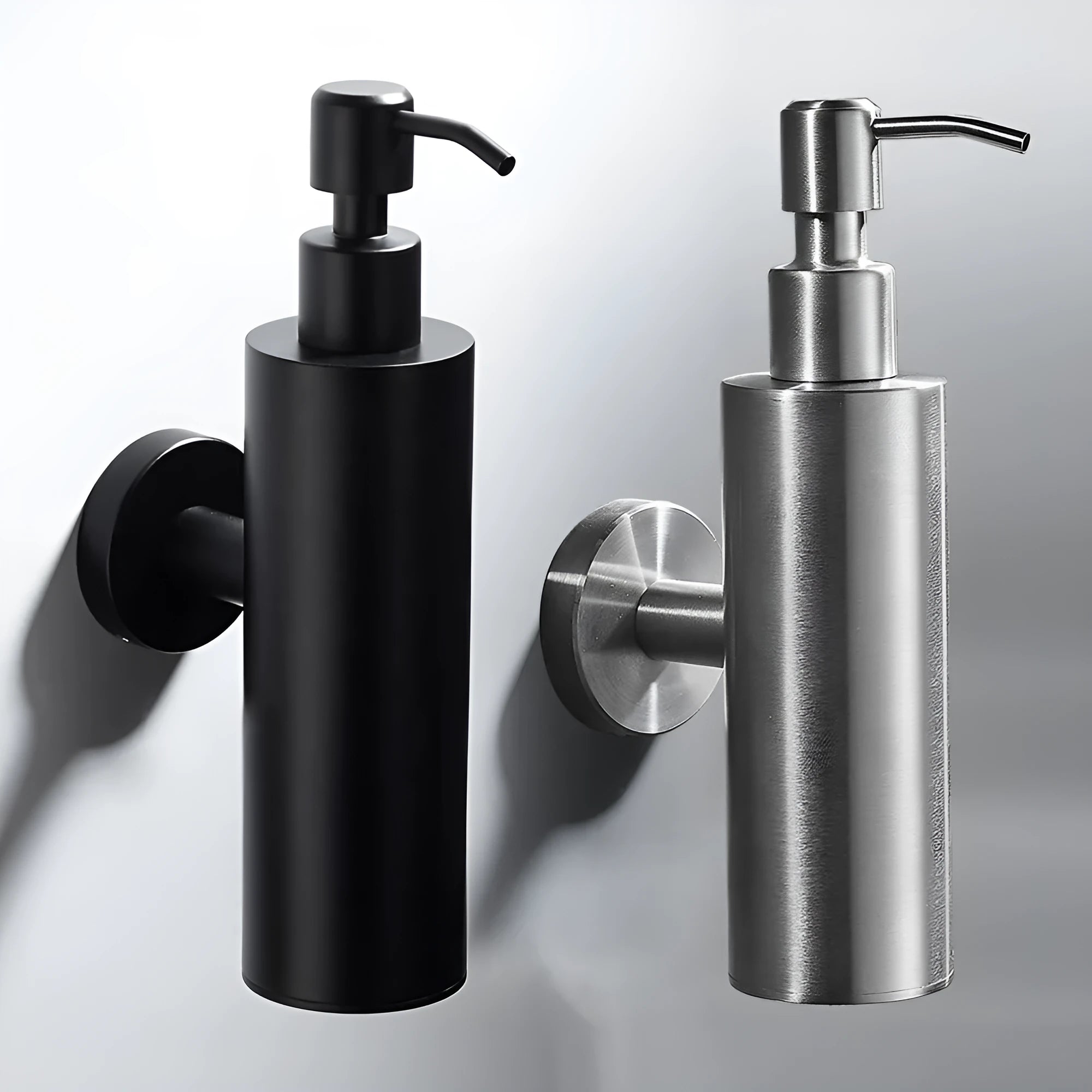 Stainless steel wall-mounted manual soap dispenser in brushed finish