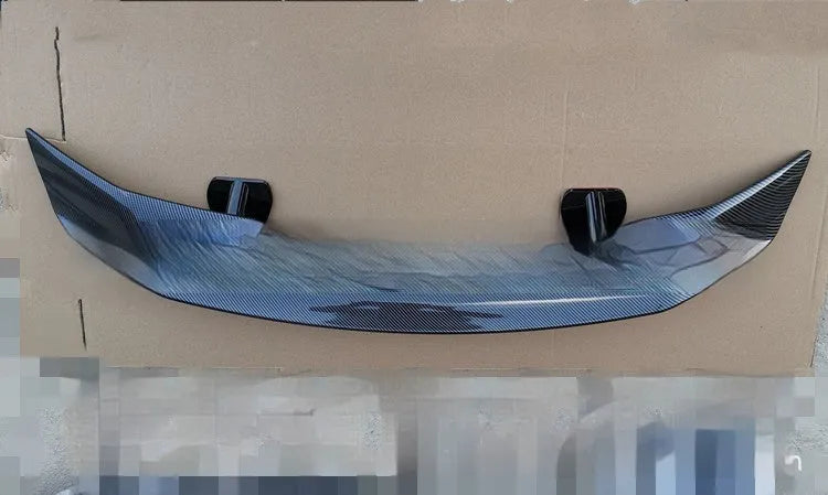 Universal punch-free car tail wing spoiler in ABS plastic shown in carbon pattern finish