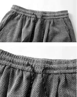 Straight-leg hollow-out trousers with elastic waist in light grey, dark grey, or black.