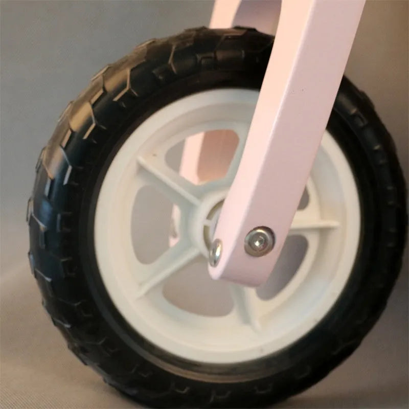 Pink wooden toddler balance scooter for children aged 1-6 years.