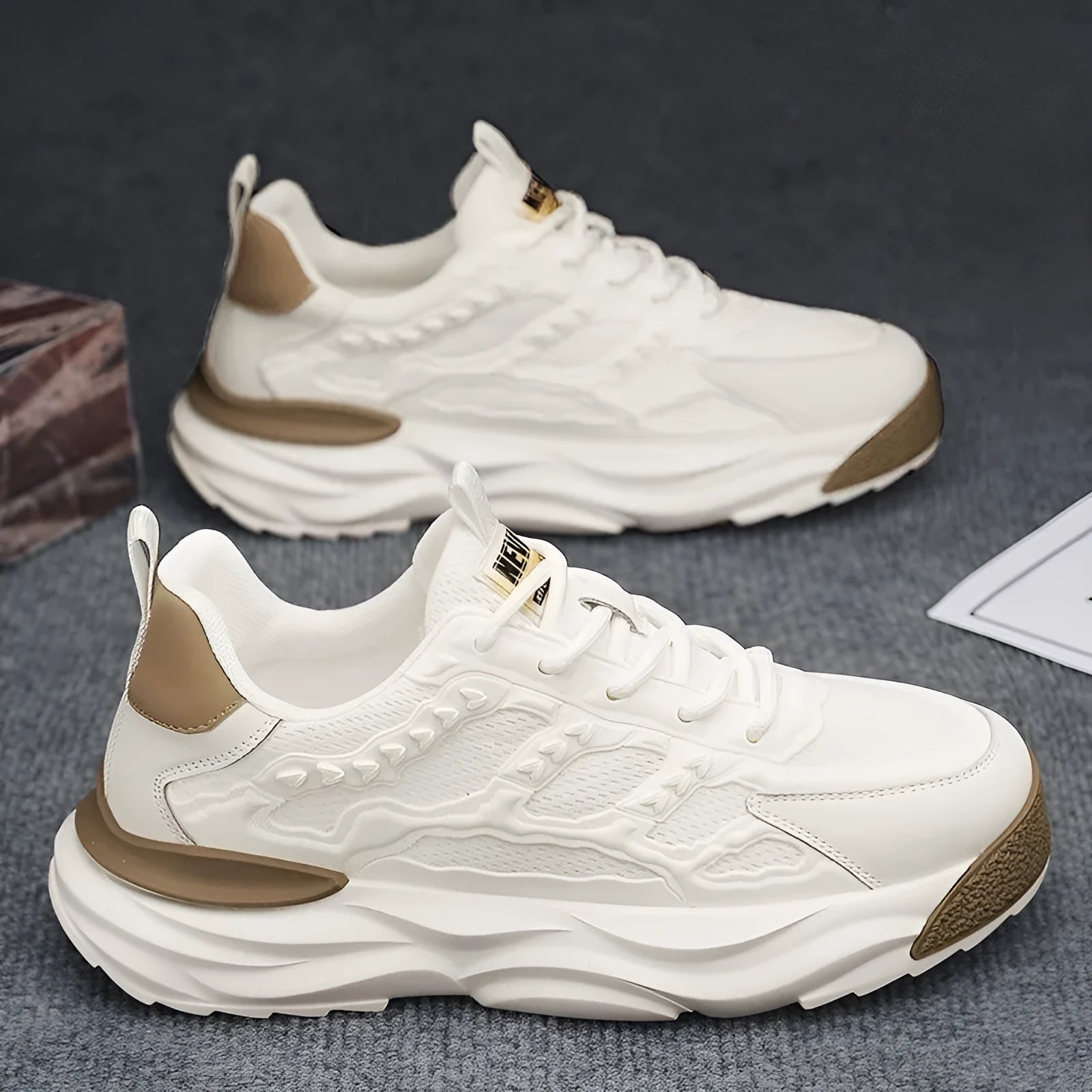 Men's solid colour PU mesh casual trainers in black or white on a white background.