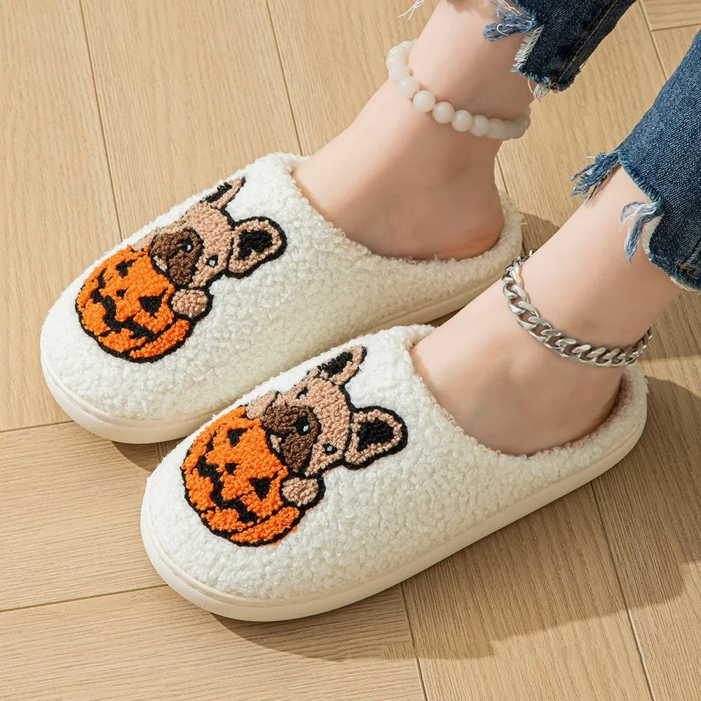 Halloween pumpkin design house slippers with plush cotton upper and TPR rubber sole in black and white.