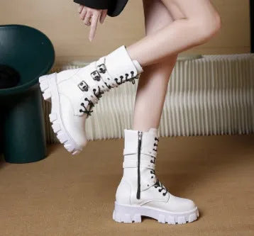 Black women's mid-calf boots with a large metal buckle and side zipper, featuring a round toe.
