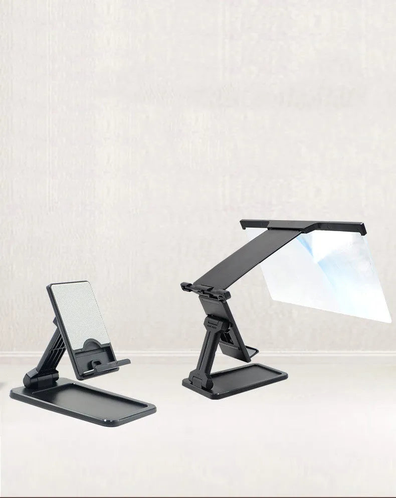 Black folding mobile phone screen amplifier with detachable phone holder on desktop