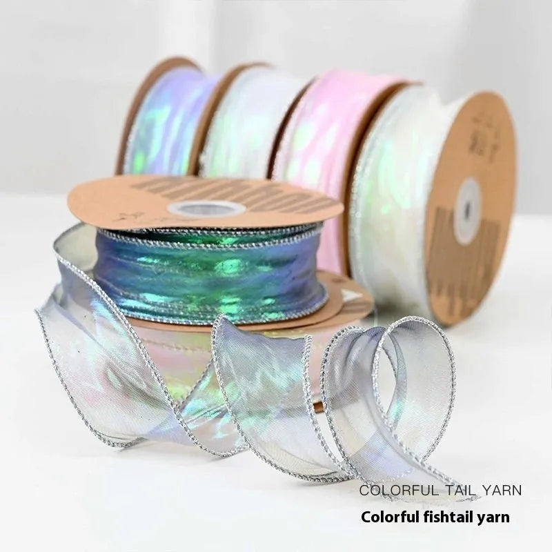 Roll of colourful fishtail yarn mesh decorative ribbon in 4cm width.