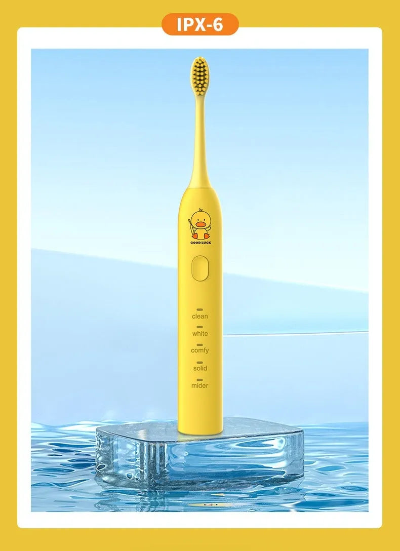 Rechargeable electric toothbrush with small yellow duck design, soft bristles, and USB charging cable