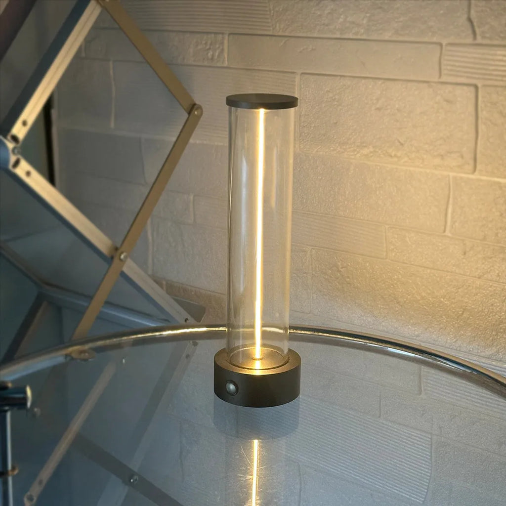 Slender white USB LED light strip with magnetic base on a metal surface