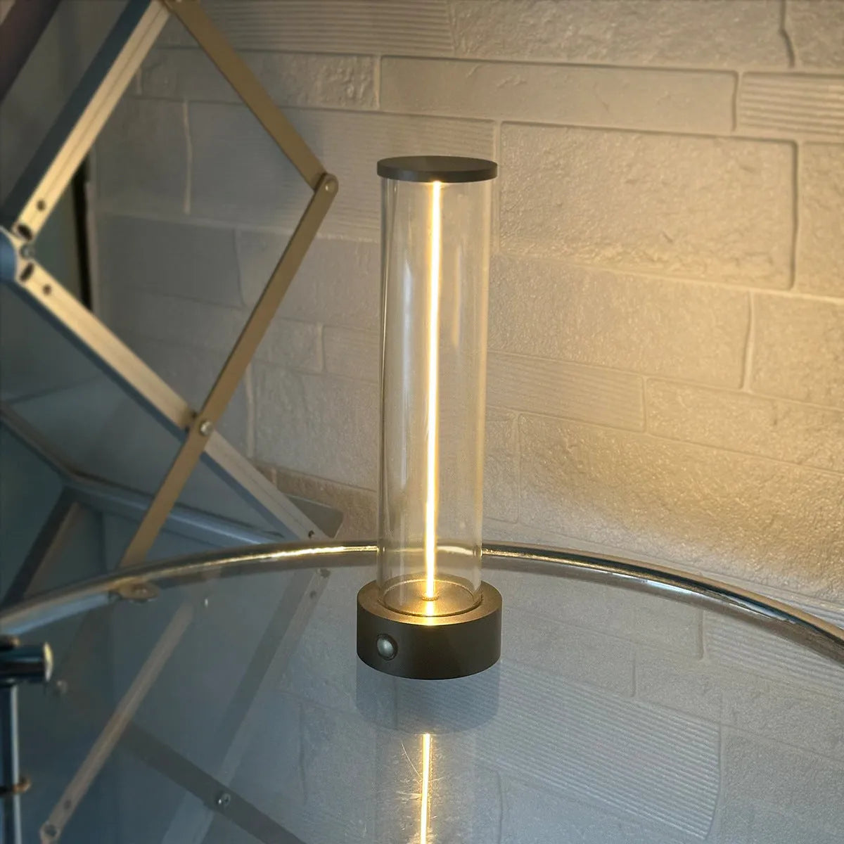 Slender white USB LED light strip with magnetic base on a metal surface