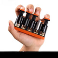 Grey or orange non-slip silicone fingerboard trainer for musician hand strength.